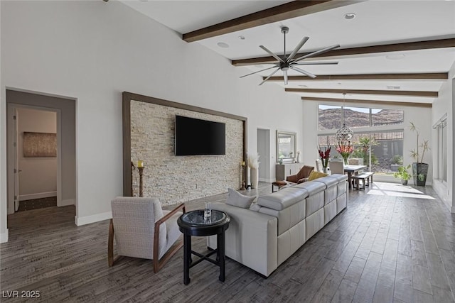 living room with ceiling fan, dark wood-type flooring, and lofted ceiling with beams