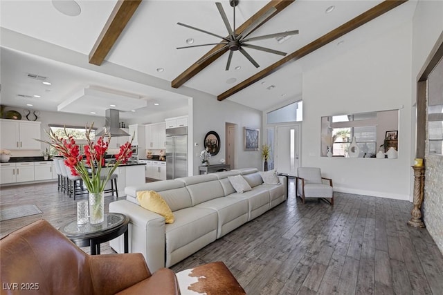 living room with wood-type flooring, beam ceiling, and high vaulted ceiling