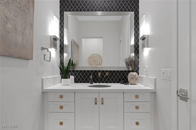 bathroom featuring decorative backsplash and vanity