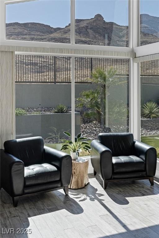 sunroom / solarium with a mountain view and a healthy amount of sunlight