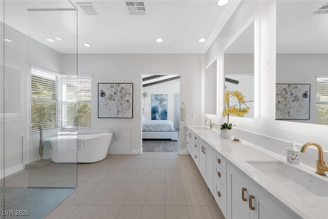 bathroom featuring a tub and vanity