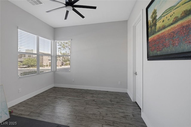 unfurnished room featuring ceiling fan and dark hardwood / wood-style flooring