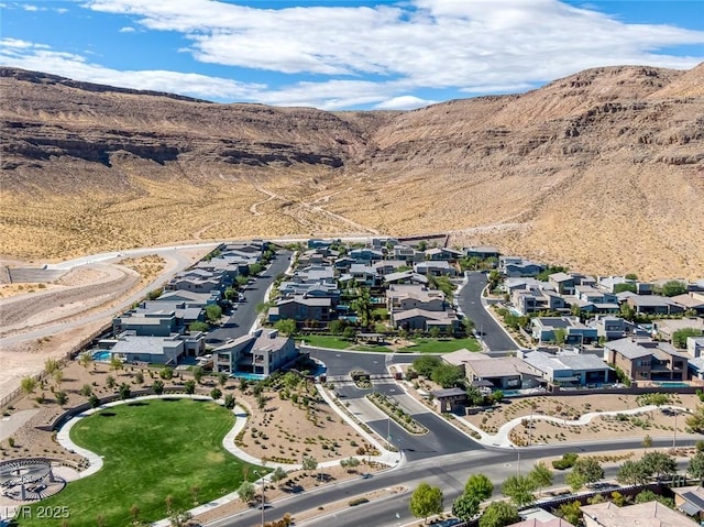 drone / aerial view featuring a mountain view