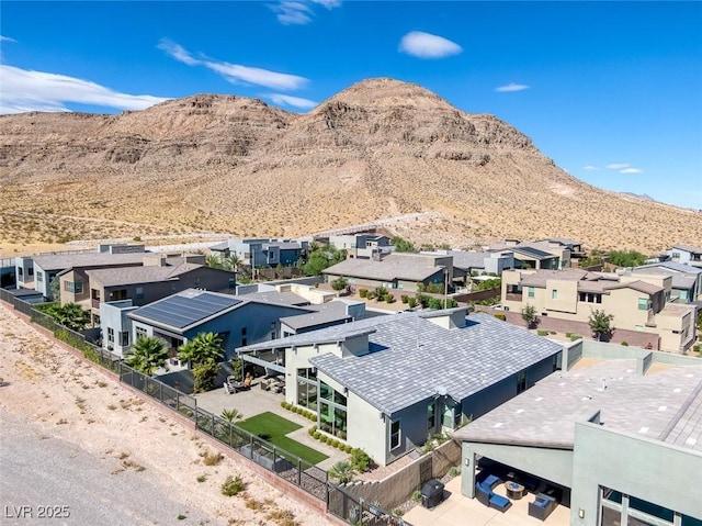 birds eye view of property featuring a mountain view