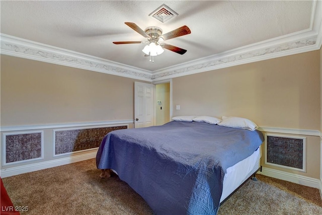 bedroom featuring crown molding, ceiling fan, and carpet floors