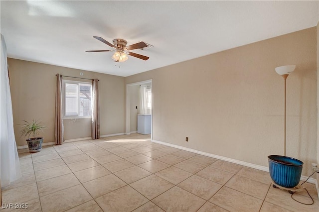 spare room with light tile patterned floors and ceiling fan