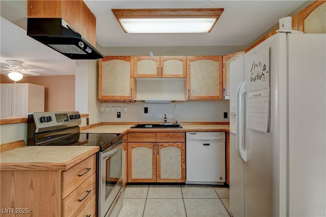 kitchen with sink, white appliances, ceiling fan, and light tile patterned flooring