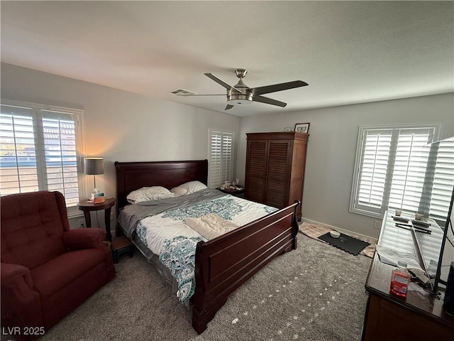 bedroom with ceiling fan and carpet