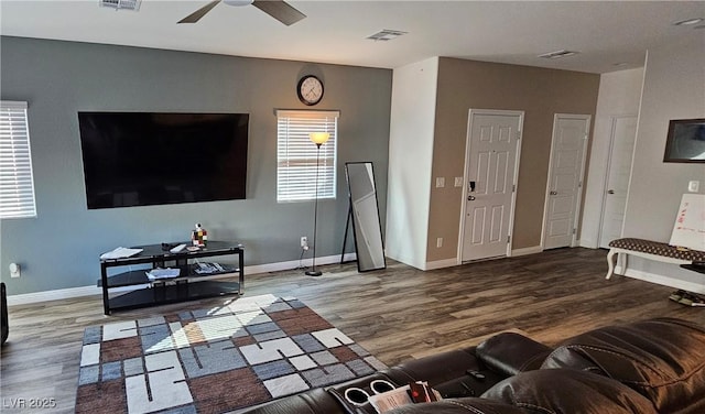 7050 Fossil Rim St, Las Vegas, NV 89084 - living room with wood finished floors, ceiling fan, and baseboards