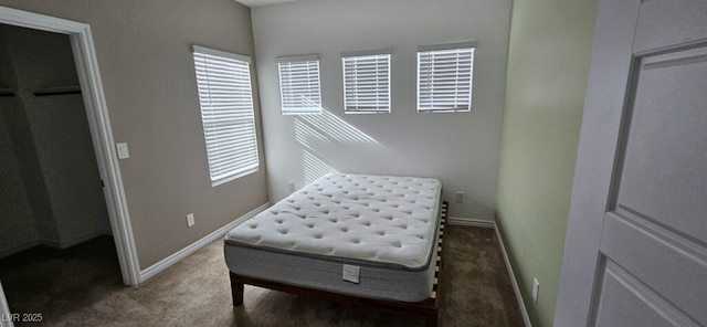 7050 Fossil Rim St, Las Vegas, NV 89084 - carpeted bedroom featuring multiple windows and baseboards