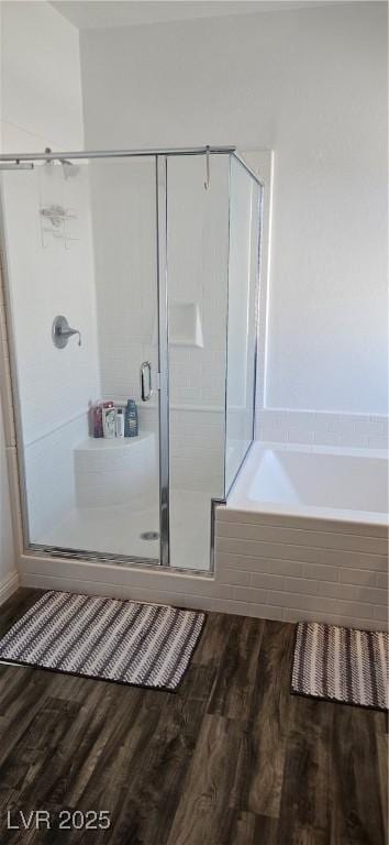 7050 Fossil Rim St, Las Vegas, NV 89084 - full bathroom with wood finished floors, a shower stall, and a garden tub