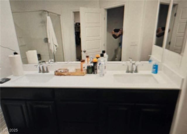 7050 Fossil Rim St, Las Vegas, NV 89084 - bathroom featuring a shower and double vanity