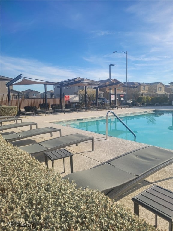 7050 Fossil Rim St, Las Vegas, NV 89084 - community pool featuring a patio