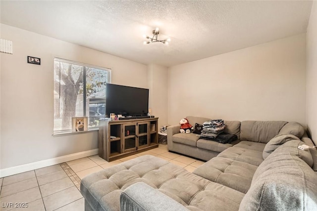 tiled living room featuring a textured ceiling