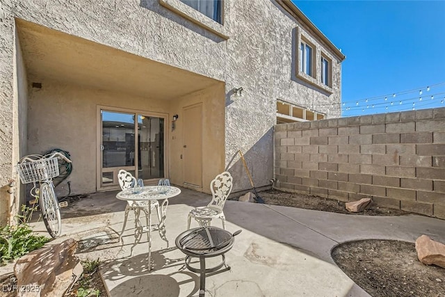 view of patio featuring a fire pit