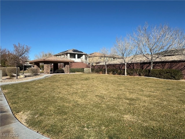 exterior space with a gazebo and a front lawn