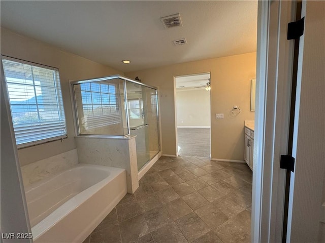 bathroom with visible vents, a stall shower, vanity, baseboards, and a bath