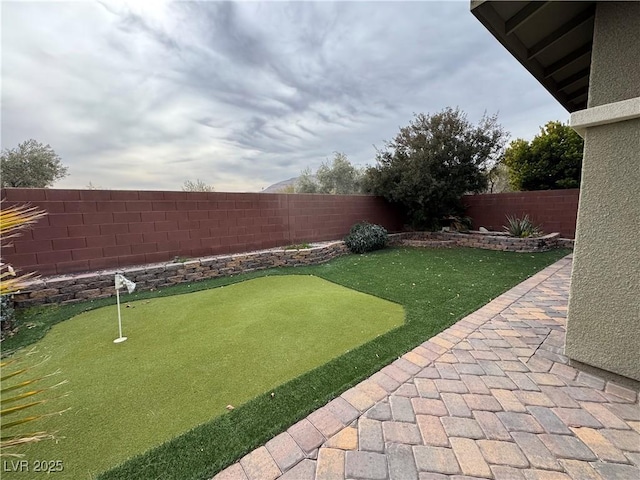 view of yard with a fenced backyard