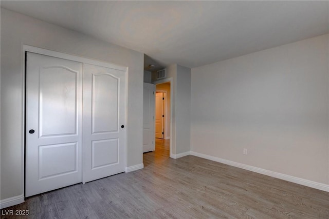 10273 Aragon Crown Rd, Las Vegas, NV 89135 - unfurnished bedroom featuring wood finished floors and baseboards