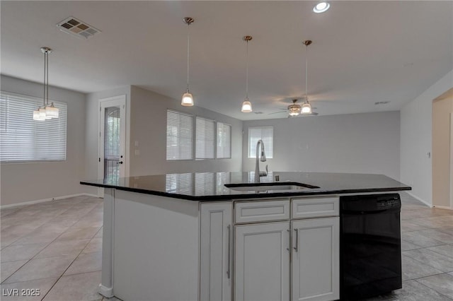 10273 Aragon Crown Rd, Las Vegas, NV 89135 - kitchen featuring a sink, dishwasher, dark countertops, and light tile patterned floors