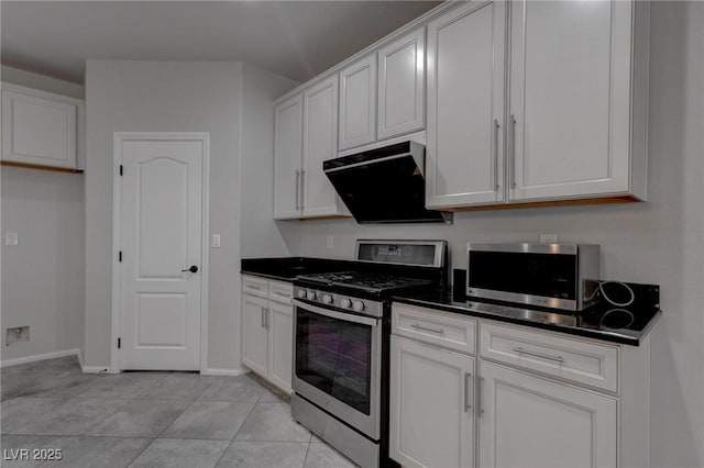 10273 Aragon Crown Rd, Las Vegas, NV 89135 - kitchen featuring stainless steel appliances, dark countertops, and white cabinetry
