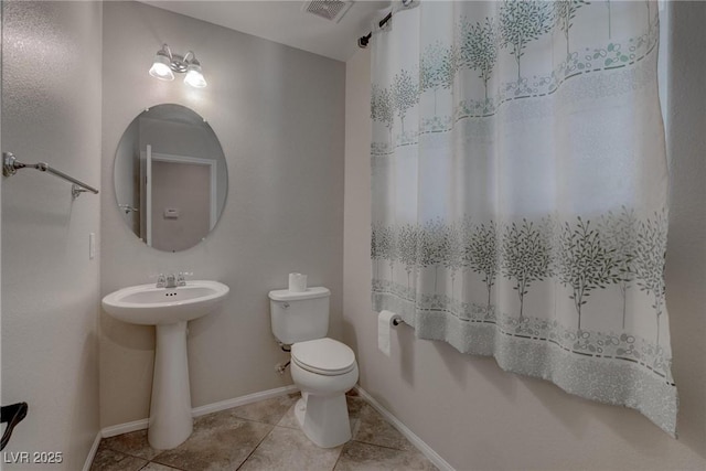 10273 Aragon Crown Rd, Las Vegas, NV 89135 - bathroom featuring toilet, tile patterned flooring, a sink, and baseboards