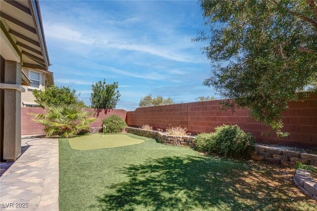 10273 Aragon Crown Rd, Las Vegas, NV 89135 - fenced backyard featuring a putting green