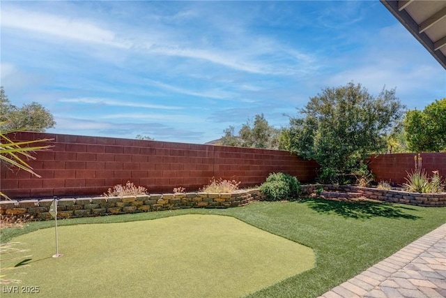 10273 Aragon Crown Rd, Las Vegas, NV 89135 - fenced backyard with a putting area