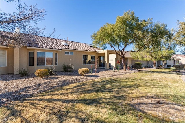 back of house with a yard