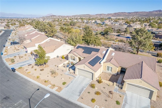 drone / aerial view featuring a mountain view