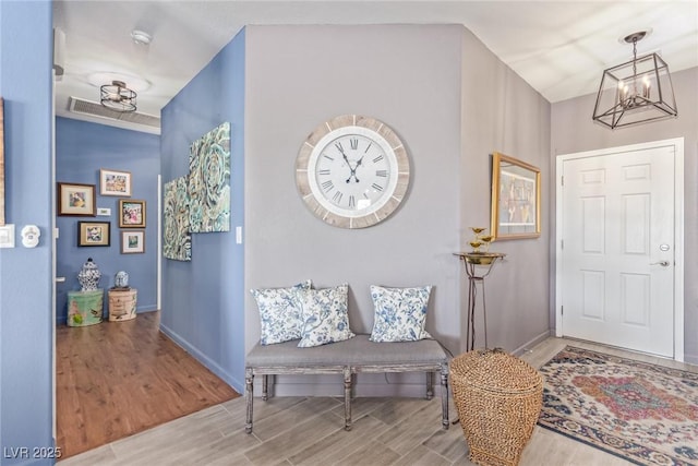 entryway with an inviting chandelier