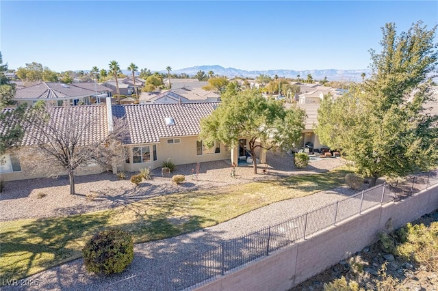 birds eye view of property featuring a mountain view