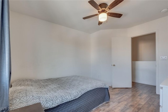 bedroom featuring ceiling fan and hardwood / wood-style flooring