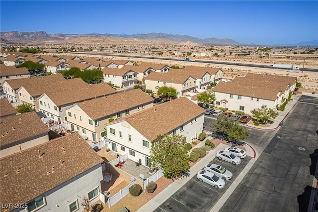 birds eye view of property with a mountain view