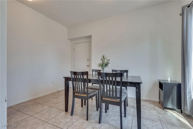 dining area with light tile patterned flooring