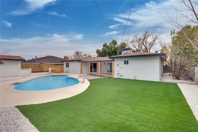 view of swimming pool featuring a yard, central AC, and a patio