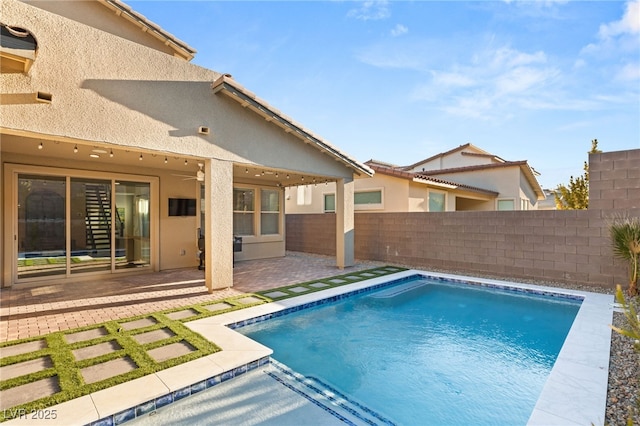 view of swimming pool with a patio