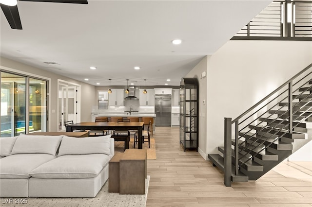 living room with light wood-type flooring and a healthy amount of sunlight