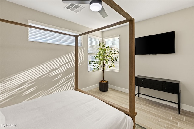 bedroom featuring ceiling fan and hardwood / wood-style flooring