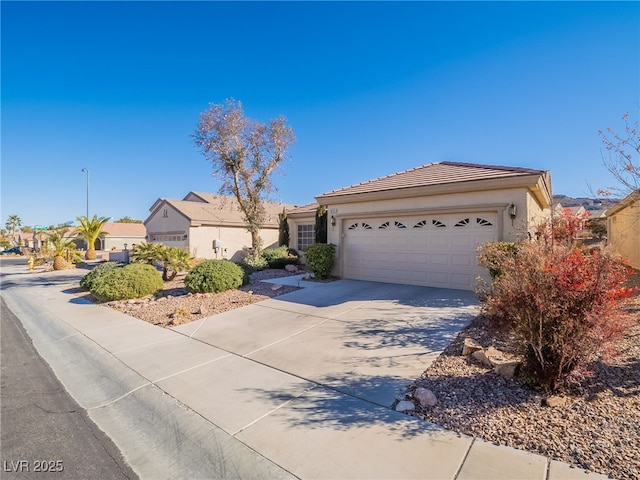 single story home with a garage