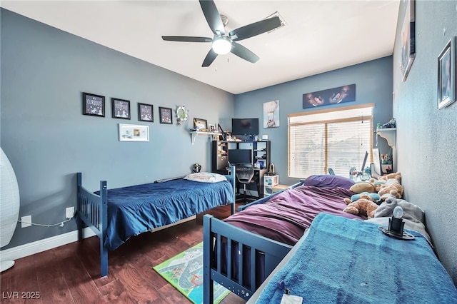 bedroom featuring dark hardwood / wood-style floors and ceiling fan