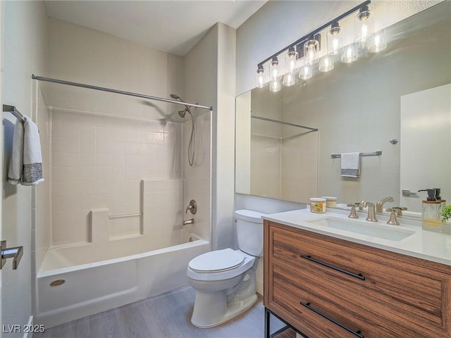 bathroom with vanity, toilet, wood finished floors, and tub / shower combination