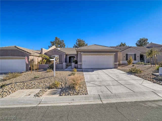 single story home with a tiled roof, stucco siding, driveway, and a garage