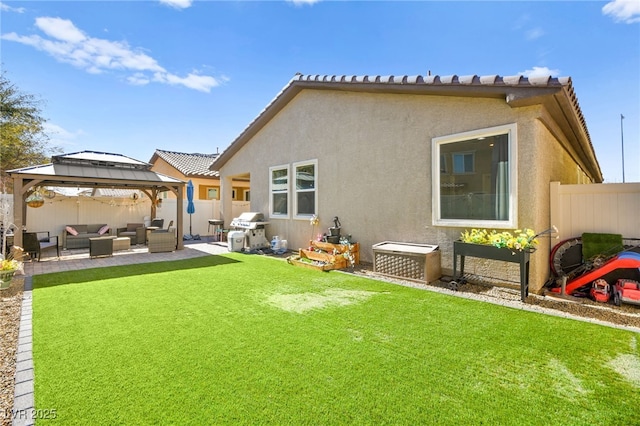 back of property with a lawn, a gazebo, and an outdoor hangout area