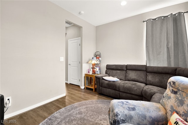 living room featuring dark hardwood / wood-style flooring