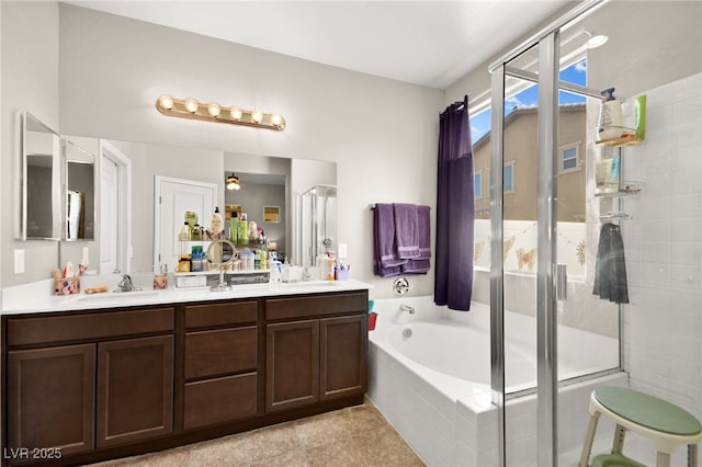 bathroom with vanity, tile patterned floors, and shower with separate bathtub