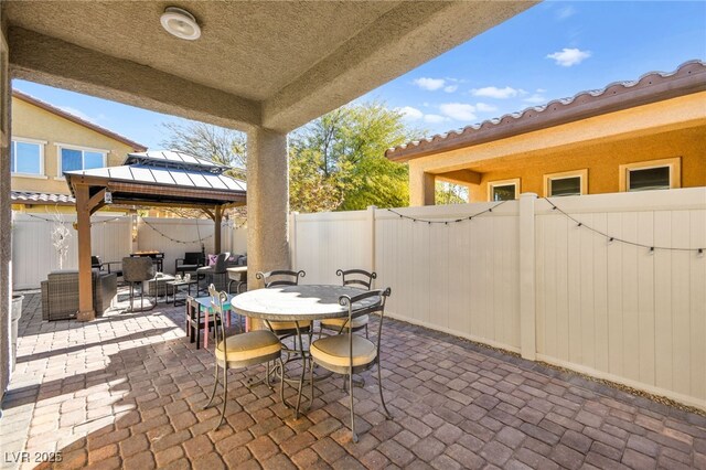 view of patio / terrace with a gazebo and outdoor lounge area