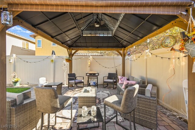 view of patio featuring a gazebo and outdoor lounge area