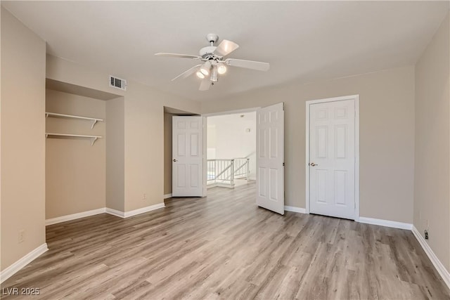 unfurnished bedroom featuring ceiling fan and light hardwood / wood-style flooring