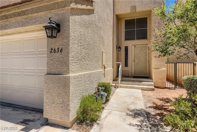 doorway to property featuring a garage